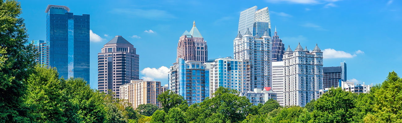 Hero Banner - Attorney Picture over skyline of Atlanta